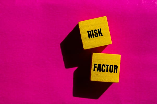 risk-factor-message-written-yellow-wooden-cubes-with-pink-background-conceptual-risk-factor-symbol-copy-space